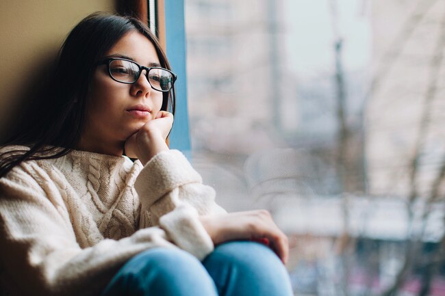 1800ss_thinkstock_rf_depressed_woman_by_window